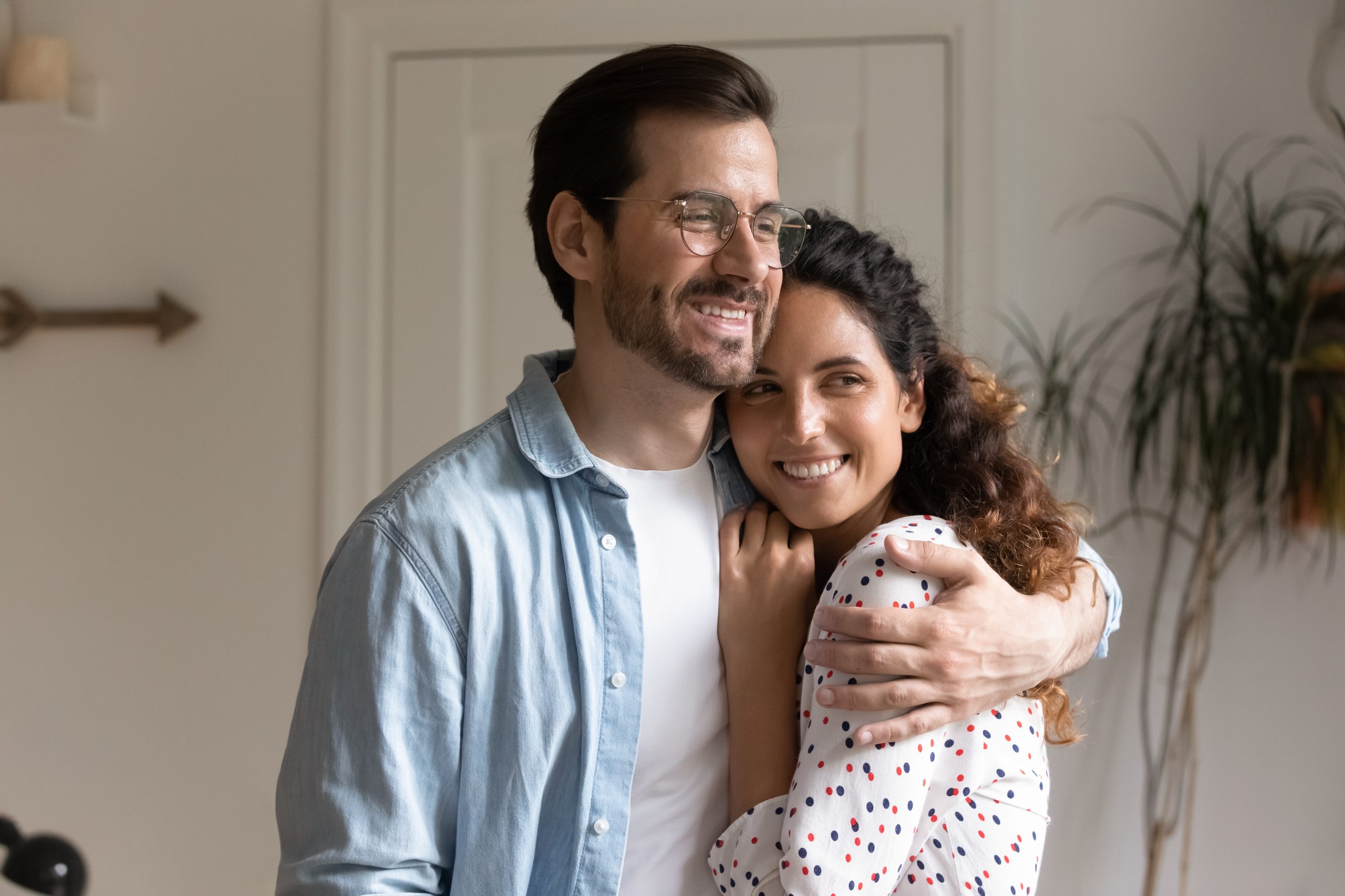 Happy couple representing positive healthcare outcomes and family support